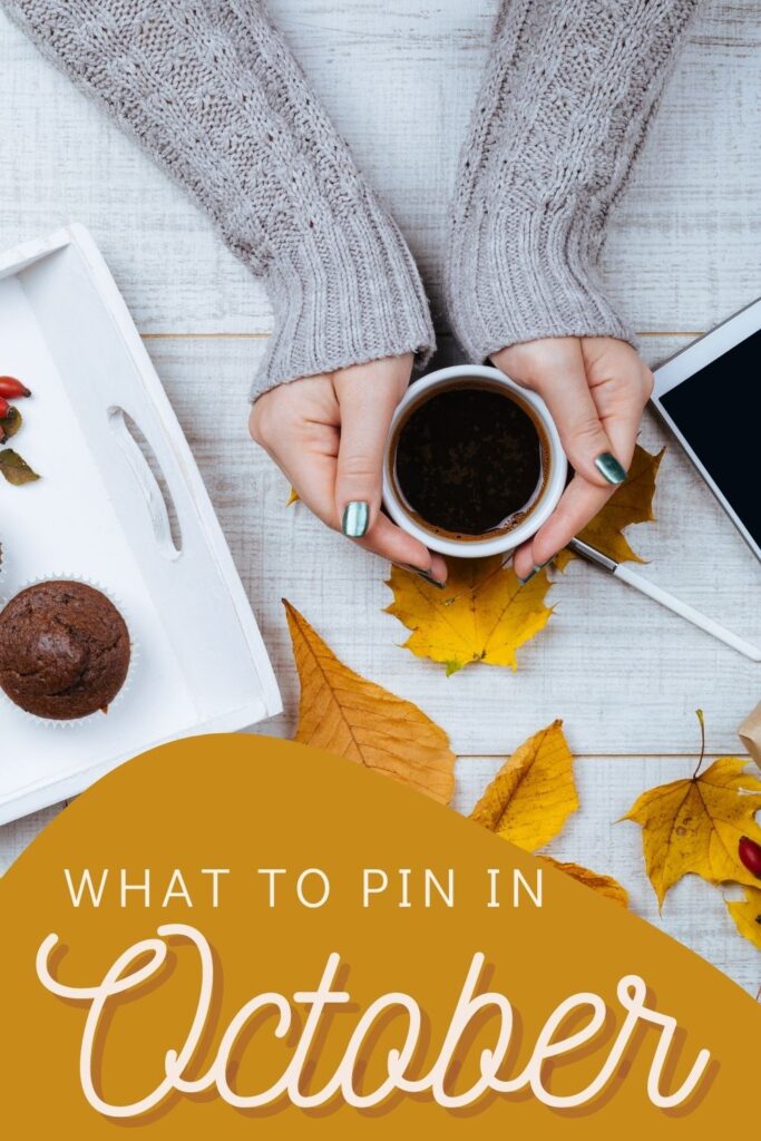 girl holding coffee mug with fall leaves on the table around her